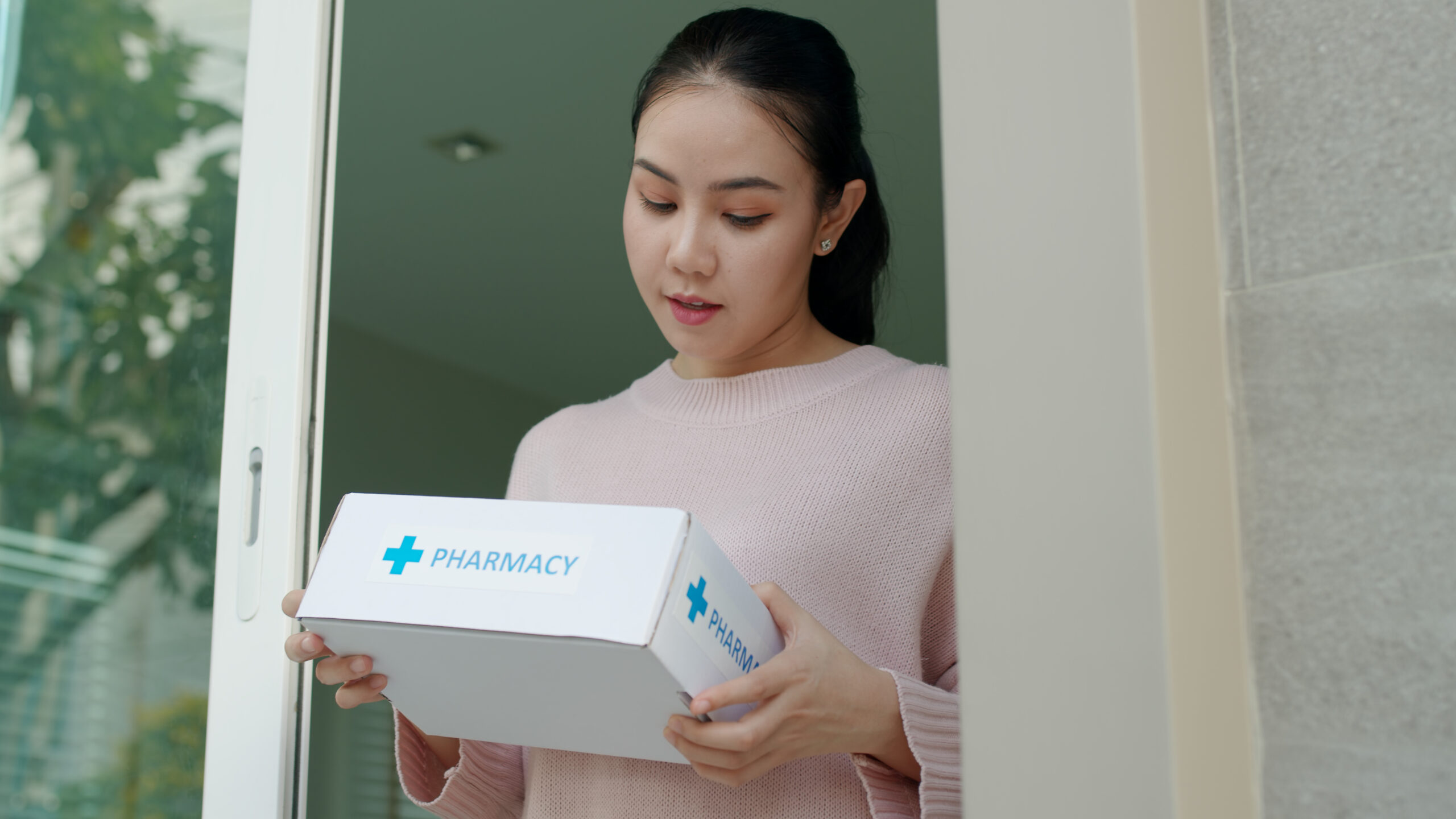 Young happy asia teen girl take covid free first aid self recover health care give for help customer people buy online clinic retail Rx drug store in telehealth telemedicine e-commerce home order.
