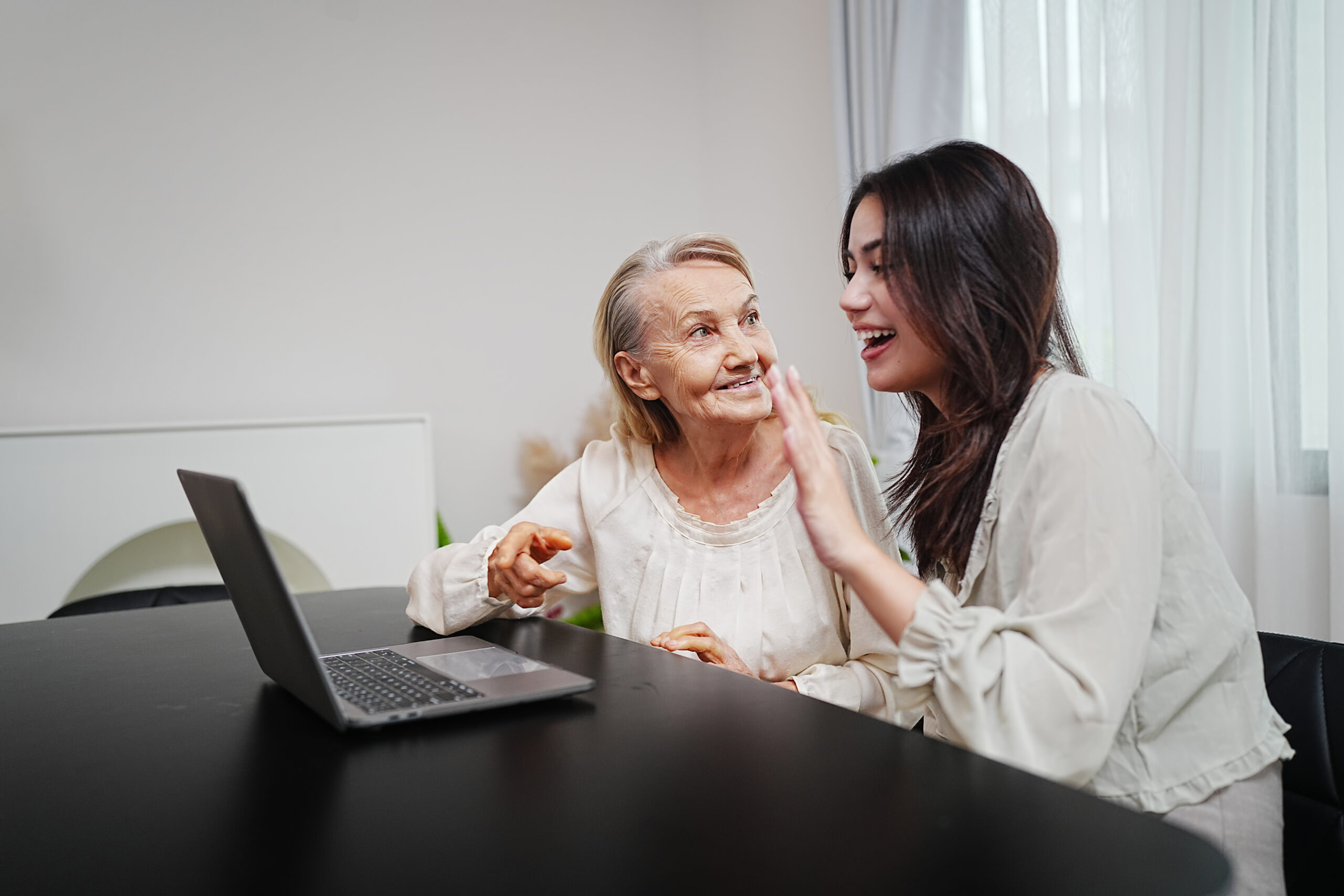 Young asian woman or nurse home care hand on senior grandmother shoulder give support empathy to elderly lady or older people in assisted living homecare mental health sick relief concept.